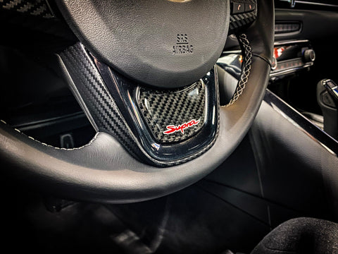 Real Carbon "Supra" Steering Wheel Trim Overlay (Lower) - 2020+ Supra - StickerFab